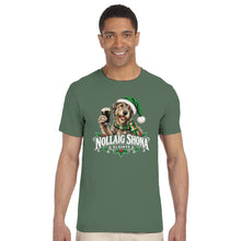 Load image into Gallery viewer, Man wearing Irish Wolfhound Christmas T-shirt featuring a shaggy wolfhound wearing a green Santa hat and Irish tricolour scarf, holding a pint of stout with Nollaig Shona and Sláinte lettering.
