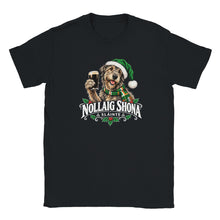 Load image into Gallery viewer, A black short-sleeve crewneck t-shirt featuring a festive graphic of a dog wearing a green Santa hat and scarf, holding a pint of stout, with the text 'NOLLAIG SHONA SLÃNTE' below.
